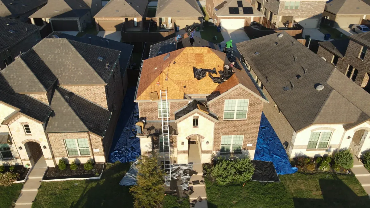 Drone view of a Roof Raiders tear-off in progress