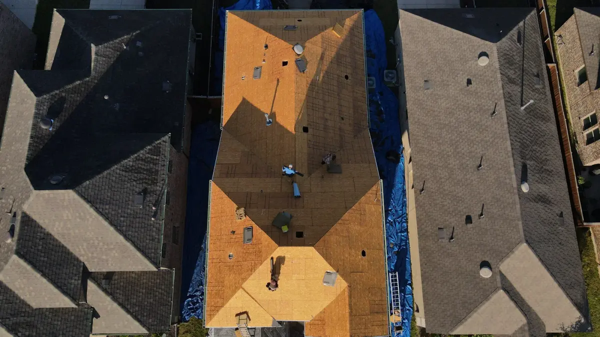 Aerial view of a North Texas residential neighborhood showing mixed asphalt shingle roof profiles