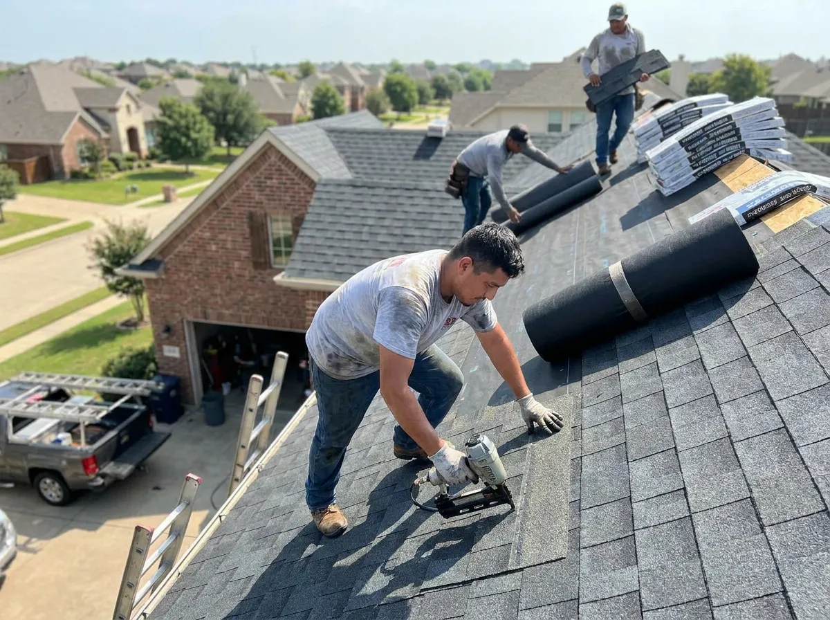 A roofer completing a residential asphalt shingle install on a North Texas home