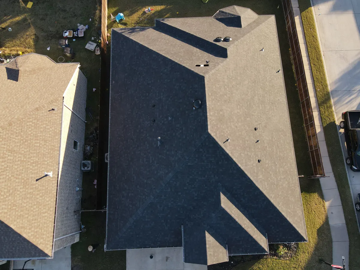 Aerial view of a North Texas residential neighborhood with asphalt shingle roofs