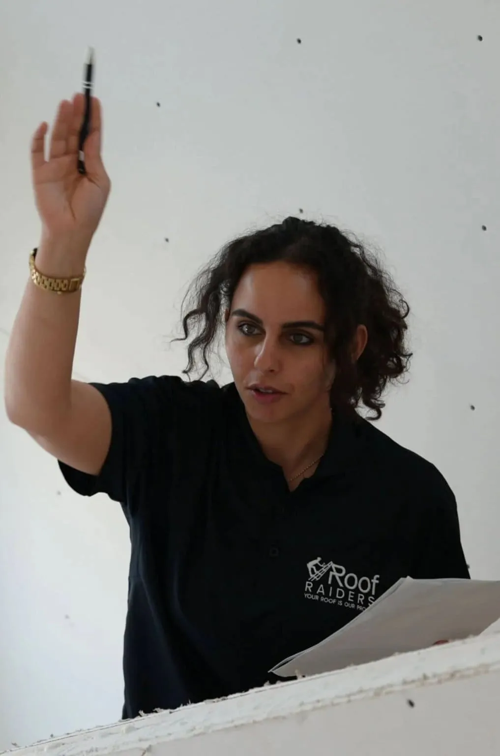 Co-owner Sara Bannat reviewing project paperwork on site